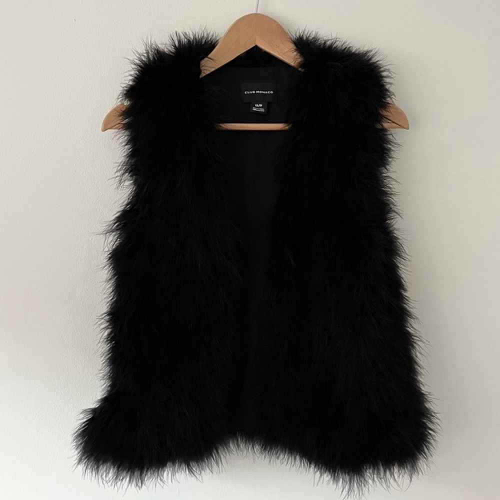 NWT. Feather black vest.